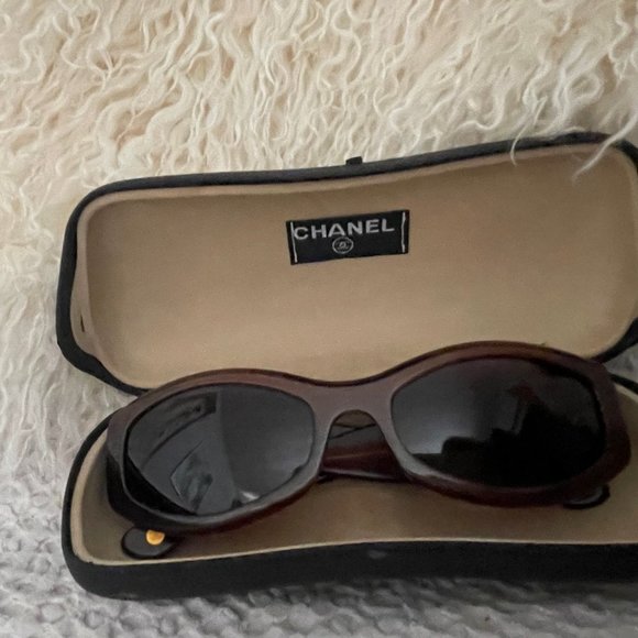 CHANEL Accessories - Chanel vintage sunglasses with gold logo. Pre-owned wiht case.